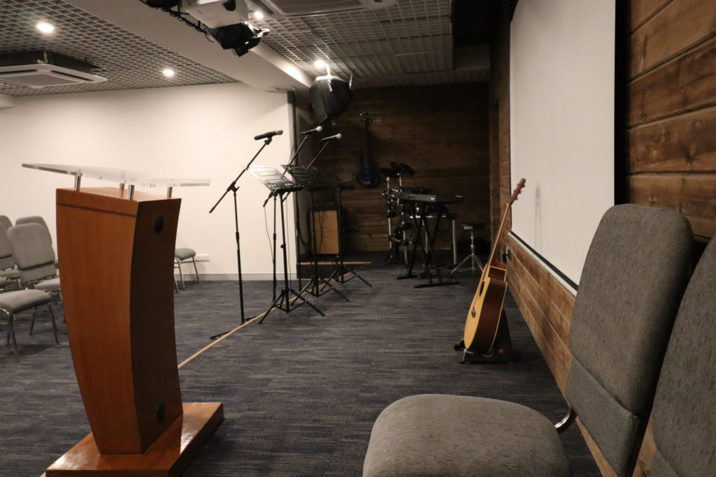 An auditorium stage with all requisite equipment